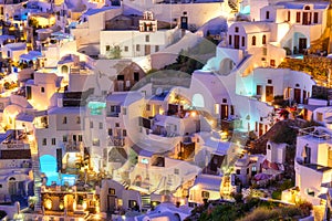 Oia village, Santorini, Greece. Architectural background.  View of traditional houses in Santorini. Small narrow streets and rooft