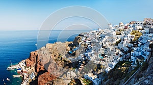 Oia village, Santorini, Greece. View of traditional houses in Santorini. Small narrow streets and rooftops of houses, churches and