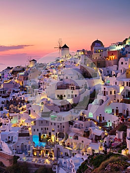 Oia village, Santorini, Greece. View of traditional houses in Santorini. Small narrow streets and rooftops of houses, churches and