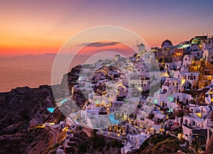 Oia village, Santorini, Greece. View of traditional houses in Santorini. Small narrow streets and rooftops of houses, churches and