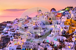 Oia village, Santorini, Greece. View of traditional houses in Santorini. Small narrow streets and rooftops of houses, churches and