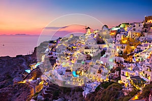 Oia village, Santorini, Greece. View of traditional houses in Santorini. Small narrow streets and rooftops of houses, churches and