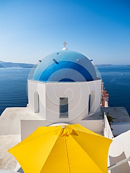 Oia village, Santorini Island, Greece. View of traditional houses and church in Santorini.