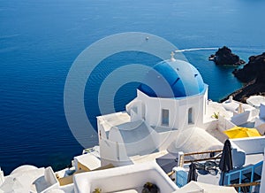 Oia village, Santorini Island, Greece. View of traditional houses and church in Santorini.