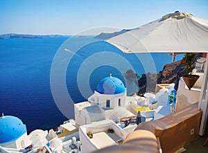 Oia village, Santorini Island, Greece. View of traditional houses and church in Santorini