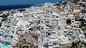 Oia village Santorini with whitewashed house and swimming pools Santorini Greece Europe