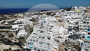 Oia village Santorini with whitewashed house and swimming pools Santorini Greece Europe