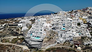 Oia village Santorini with whitewashed house and swimming pools Santorini Greece Europe