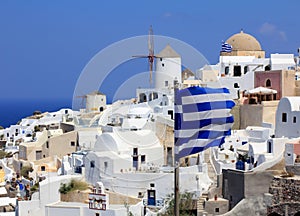 Oia Windmills And Greek Flags - Santorini Island