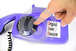 OID original issue discount symbol. Concept words OID original issue discount on beautiful old disk phone. Beautiful white