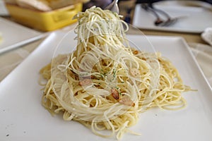 Oil base pasta Spaghetti Aglio on the table
