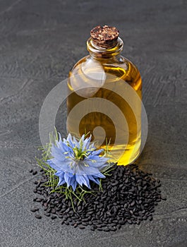 Oil of black cumin seed and nigella sativa flowe