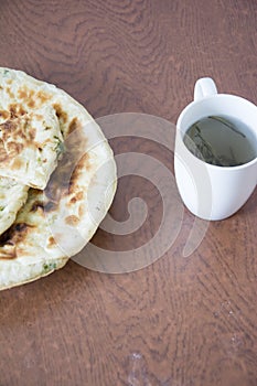 Oil cake and tea cup