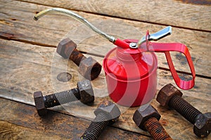 Oil can on wooden background, Lube oil can and used in industry or hard works