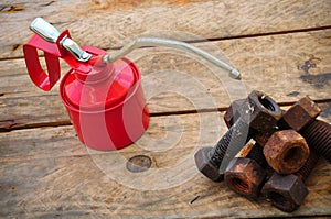 Oil can on wooden background, Lube oil can and used in industry or hard works