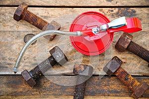 Oil can on wooden background, Lube oil can and used in industry or hard works