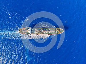 Oil chemical tanker sails blue sea. Aerial top view photo