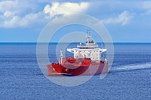 Oil/Chemical tanker under cloudy sky.