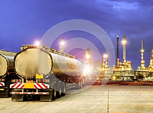 Oil container truck and beautiful lighting of oil refinery plant