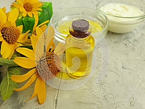 Oil cosmetic soap accessories  health    shower  essential  aromatherapy   calendula flower on concrete background