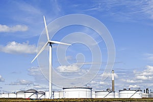 Oil depot with storage tanks and wind turbine