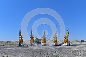 Oil derricks in the desert, near Wuerhe Wind City, at the lower reaches of the Jiamu River, Northern Xinjiang, China