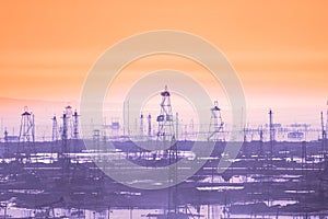 Oil derricks on early morning