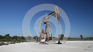 Oil derricks in hagerman wildlife refuge on lake Texoma.