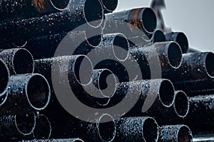 Oil Drill pipe. Rusty drill pipes were drilled in the well section. Downhole drilling rig.