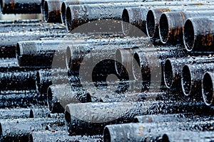 Oil Drill pipe. Rusty drill pipes were drilled in the well section. Downhole drilling rig.