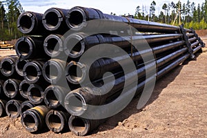 Oil Drill pipe. Rusty drill pipes were drilled in the well section. Downhole drilling rig. Laying the pipe on the deck. View of