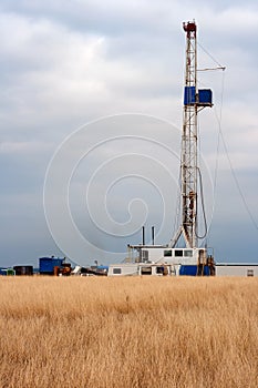 Oil Drilling Rig in a Hay Field