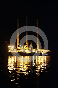 Oil drilling rig with reflection