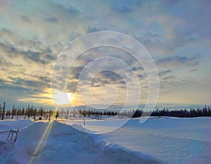 Oil drilling rig. Winter at dawn in the snow