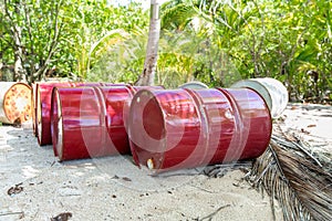 Oil drum barrels on beach in french polynesia