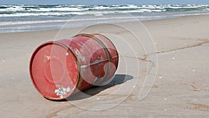 Oil drum after a storm washed ashore on the beach of the Curonian Spit National Park