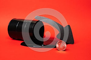 Oil flowing out of the barrel with a one ruble coin and down arrow on a red background
