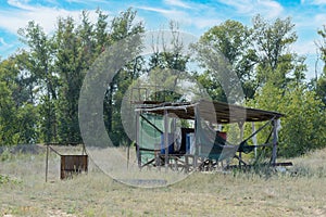 Oil and fuel barrels under shed on a farm