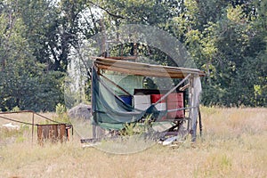 Oil and fuel barrels under shed on a farm