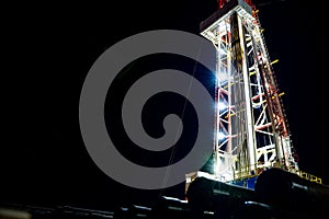 Oil and Gas Drilling Rig. Oil drilling rig operation on the oil platform in oil and gas industry. Beautiful night view of derrick