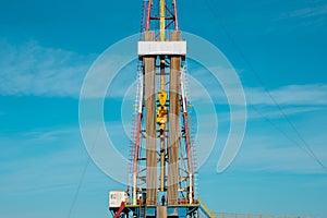 Oil and Gas Drilling Rig. Oil drilling rig operation on the oil platform in oil and gas industry. Top drive system of