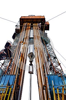 Oil and Gas Drilling Rig. Oil platform isolated on white background. Drilling rig in oil field for drilled into subsurface in