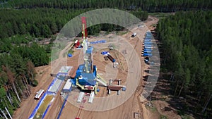 Oil gas drilling tower in forest