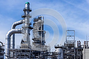 Oil and gas industrial with blue sky background, Oil refinery plant form industry zone, Refinery factory oil storage tank and