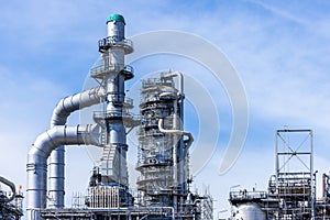 Oil and gas industrial with blue sky background, Oil refinery plant form industry zone, Refinery factory oil storage tank and