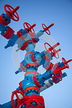 Oil, gas industry. Group wellheads and valve armature ,Gas well of high pressure; gas production process, vertical foto