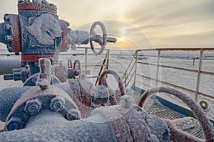 Oil, gas industry. Group wellheads and valve fittings are covered with hoarfrost,Gas valve, Gas well of high pressure; gas