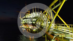 Oil and gas industry and hard work at night time. Offshore construction platform