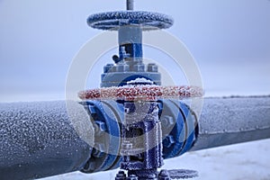 Oil, gas industry. High pressure gas well, pipe fittings, valves in frost in the frost