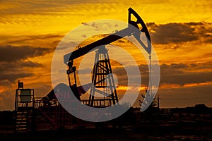 Oil and gas industry. Oil pump oil rig energy industrial machine for petroleum in the sunset background, Increase in oil